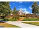 Beautiful brick building on a landscaped lawn with ample space for a quiet surrounding at 409 Thunder Rd, Buford, GA 30518