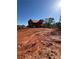 Exterior view of home under construction on a sunny day with a large yard at 409 Thunder Rd, Buford, GA 30518