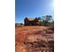Exterior view of home under construction on a sunny day with a large yard at 409 Thunder Rd, Buford, GA 30518