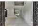 Grand foyer with an iron staircase, white wood paneling, and an open concept design at 409 Thunder Rd, Buford, GA 30518
