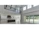Spacious open floor plan featuring access to a modern kitchen, second story and backyard at 409 Thunder Rd, Buford, GA 30518