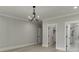 This bedroom features a view into an ensuite bath and walk-in closet at 409 Thunder Rd, Buford, GA 30518