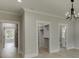 This bedroom features a view into an ensuite bath and walk-in closet at 409 Thunder Rd, Buford, GA 30518