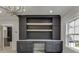This office area features an elegant built in desk and shelving unit with a decorative light fixture at 409 Thunder Rd, Buford, GA 30518