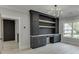 This office area features an elegant built in desk and shelving unit with a decorative light fixture at 409 Thunder Rd, Buford, GA 30518