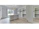 Generous walk-in closet featuring custom shelving, a central island with marble countertop, and ample storage space at 409 Thunder Rd, Buford, GA 30518