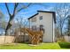Two story home with a large wooden deck, stairs, and a fenced-in backyard at 676 S Grand Nw Ave, Atlanta, GA 30318