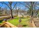 Fenced backyard with green grass and view of the neighborhood at 676 S Grand Nw Ave, Atlanta, GA 30318