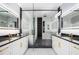 Modern bathroom with dual sinks, a glass-enclosed shower, and a soaking tub at 676 S Grand Nw Ave, Atlanta, GA 30318