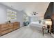 Serene bedroom with light-colored walls, modern furnishings, and a ceiling fan at 676 S Grand Nw Ave, Atlanta, GA 30318