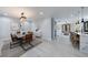 Inviting dining room with modern lighting, stylish furniture, and easy access to kitchen at 676 S Grand Nw Ave, Atlanta, GA 30318