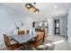 Bright dining room featuring a stylish table with brown leather chairs and a modern light fixture at 676 S Grand Nw Ave, Atlanta, GA 30318