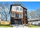 Stunning two-story home with modern design, a small balcony, and an attached garage at 676 S Grand Nw Ave, Atlanta, GA 30318