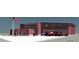 Rendering of a fire station featuring red brick, large windows, and multiple fire trucks at 676 S Grand Nw Ave, Atlanta, GA 30318
