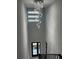 Bright foyer showcasing a modern chandelier and ample natural light at 676 S Grand Nw Ave, Atlanta, GA 30318
