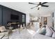 Spacious living room with hardwood floors, modern fireplace, and an open concept kitchen at 676 S Grand Nw Ave, Atlanta, GA 30318