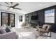 Bright living room featuring dark accent wall, contemporary fireplace, and stylish furniture at 676 S Grand Nw Ave, Atlanta, GA 30318