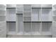Custom walk-in closet offering ample storage space with shelving and drawers at 676 S Grand Nw Ave, Atlanta, GA 30318