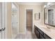 Modern bathroom featuring a sleek vanity, ample storage, and a combined shower and tub at 2605 Vineyard Se Way, Smyrna, GA 30082
