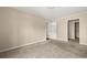 This neutral bedroom leads into a walk-in closet and a bathroom at 2605 Vineyard Se Way, Smyrna, GA 30082