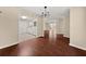Dining room with hardwood floors, access to living areas, and adjacent kitchen at 2605 Vineyard Se Way, Smyrna, GA 30082