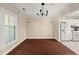 Dining room featuring hardwood floors, chandelier, and large windows at 2605 Vineyard Se Way, Smyrna, GA 30082