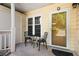 Inviting front porch with table and chairs, perfect for relaxing outdoors at 2605 Vineyard Se Way, Smyrna, GA 30082