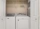 Laundry room featuring a Maytag washer and dryer, with shelving for storage at 2605 Vineyard Se Way, Smyrna, GA 30082