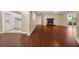 Hardwood floors throughout living room, open to the kitchen and dining room with fireplace at 2605 Vineyard Se Way, Smyrna, GA 30082