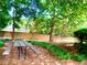 Community picnic area featuring several tables and lush landscaping for outdoor gatherings at 2605 Vineyard Se Way, Smyrna, GA 30082