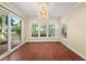 Bright sunroom filled with natural light, terracotta tile floors and direct access to an outdoor deck at 2605 Vineyard Se Way, Smyrna, GA 30082