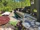 Aerial view of a modern home showcasing a lap pool, stone patio, and landscaped yard at 265 Tara Trl, Atlanta, GA 30327