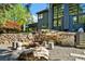 Backyard with stone retaining wall, outdoor seating, and fire pit at 265 Tara Trl, Atlanta, GA 30327