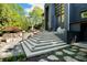 Modern home with backyard patio, landscaping, and stone staircase at 265 Tara Trl, Atlanta, GA 30327