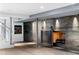Basement showcasing a modern fireplace with a sliding door and decorative wall at 265 Tara Trl, Atlanta, GA 30327