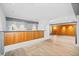 Basement bar with wood paneling and light wood flooring at 265 Tara Trl, Atlanta, GA 30327