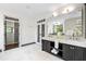 Bright bathroom with double vanity, a walk-in closet, and natural light at 265 Tara Trl, Atlanta, GA 30327