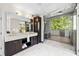 Elegant bathroom featuring a double vanity, modern fixtures, and large glass shower at 265 Tara Trl, Atlanta, GA 30327