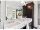 Bathroom featuring double vanity, marble countertop, and dark wood cabinetry at 265 Tara Trl, Atlanta, GA 30327