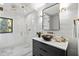 Bright bathroom with a stand-alone shower, stylish vanity, and updated lighting at 265 Tara Trl, Atlanta, GA 30327