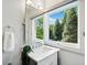 Cozy bathroom with a large window, marble countertop, and updated fixtures at 265 Tara Trl, Atlanta, GA 30327