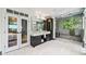 Luxurious bathroom features marble floors, a large glass shower, and double vanity at 265 Tara Trl, Atlanta, GA 30327