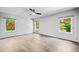 Bright bedroom with hardwood floors and backyard views from three windows at 265 Tara Trl, Atlanta, GA 30327