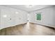 Spacious bedroom with hardwood floors, ample closet space, and a window view at 265 Tara Trl, Atlanta, GA 30327