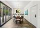 Bright dining room featuring an elegant light fixture, sliding glass doors and stylish decor at 265 Tara Trl, Atlanta, GA 30327
