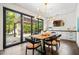 Beautiful dining area with modern lighting, a large glass sliding door and stylish table decor at 265 Tara Trl, Atlanta, GA 30327