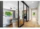 Contemporary living room with modern lighting, large windows, and stylish furnishings at 265 Tara Trl, Atlanta, GA 30327