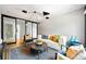 Bright living room featuring stylish seating, a modern rug, and a contemporary light fixture at 265 Tara Trl, Atlanta, GA 30327