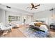 Spacious main bedroom features contemporary decor, a ceiling fan and access to a private bath at 265 Tara Trl, Atlanta, GA 30327