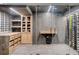 Beautifully designed wine cellar with glass doors, custom wine racks, and built-in cabinetry at 265 Tara Trl, Atlanta, GA 30327